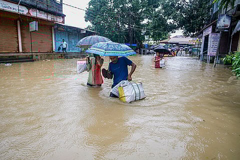 Flood in Tripura: People wade through floodwater